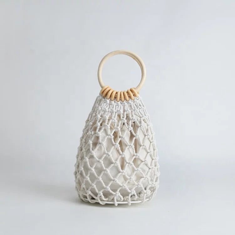 light weight crotchet beach bag with removable pocket slip. Available in white and tan, perfect for beach.